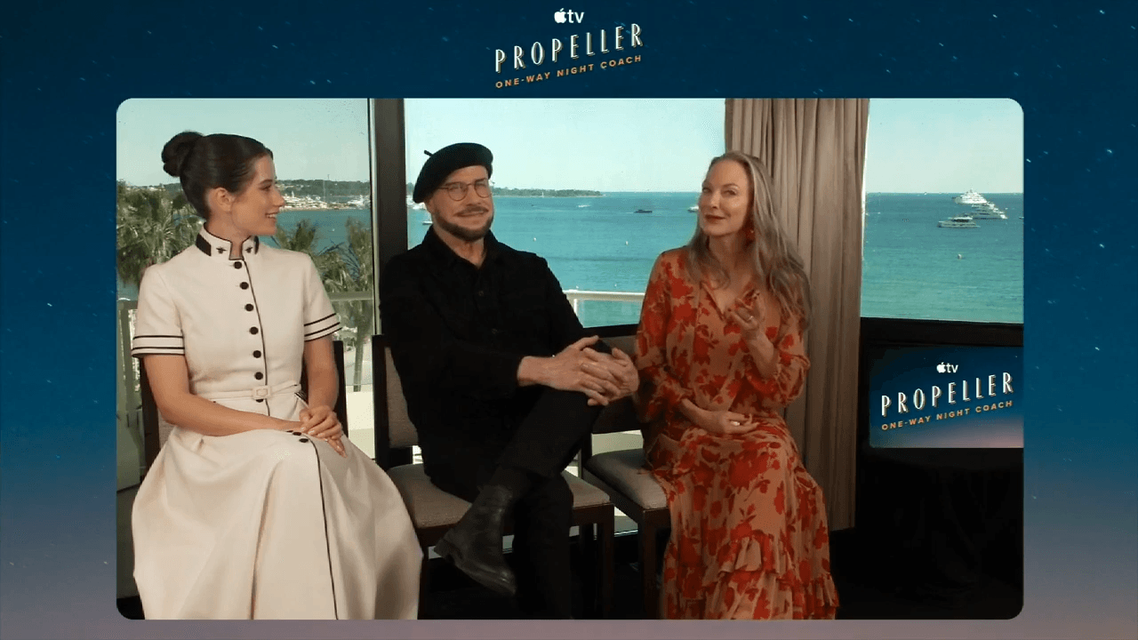 Deco talks with movie star John Travolta about his upcoming movie, “Propeller One-Way Night Coach”