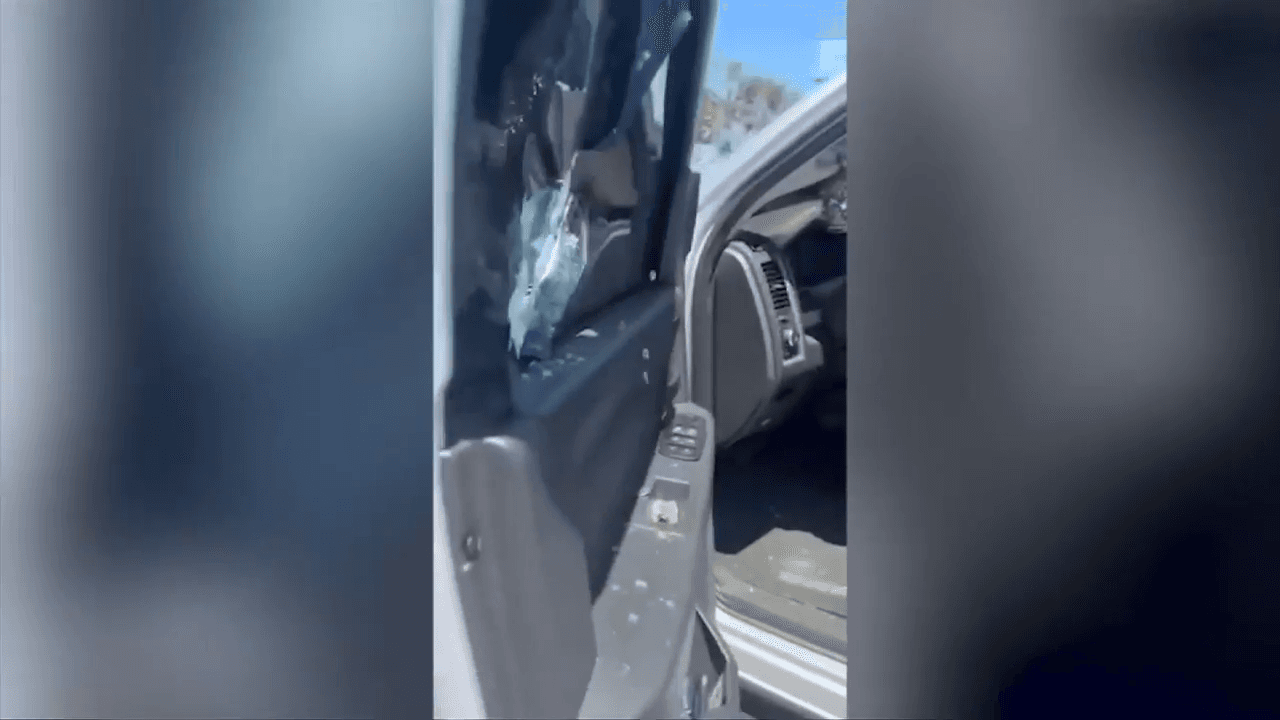 Father punches through car window after young son accidentally locked siblings inside
