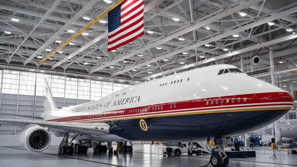 President Donald Trump unveils the new Air Force One, a converted Qatari jet