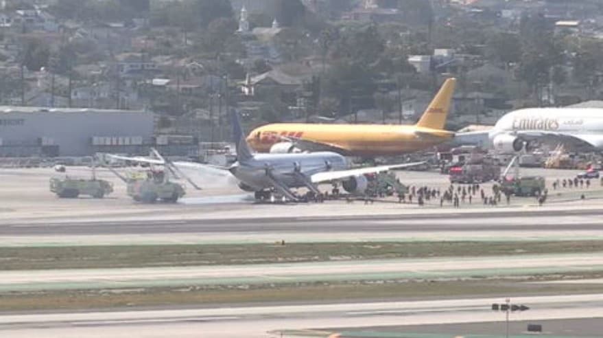 United flight returns to LA airport for an evacuation after a reported fire